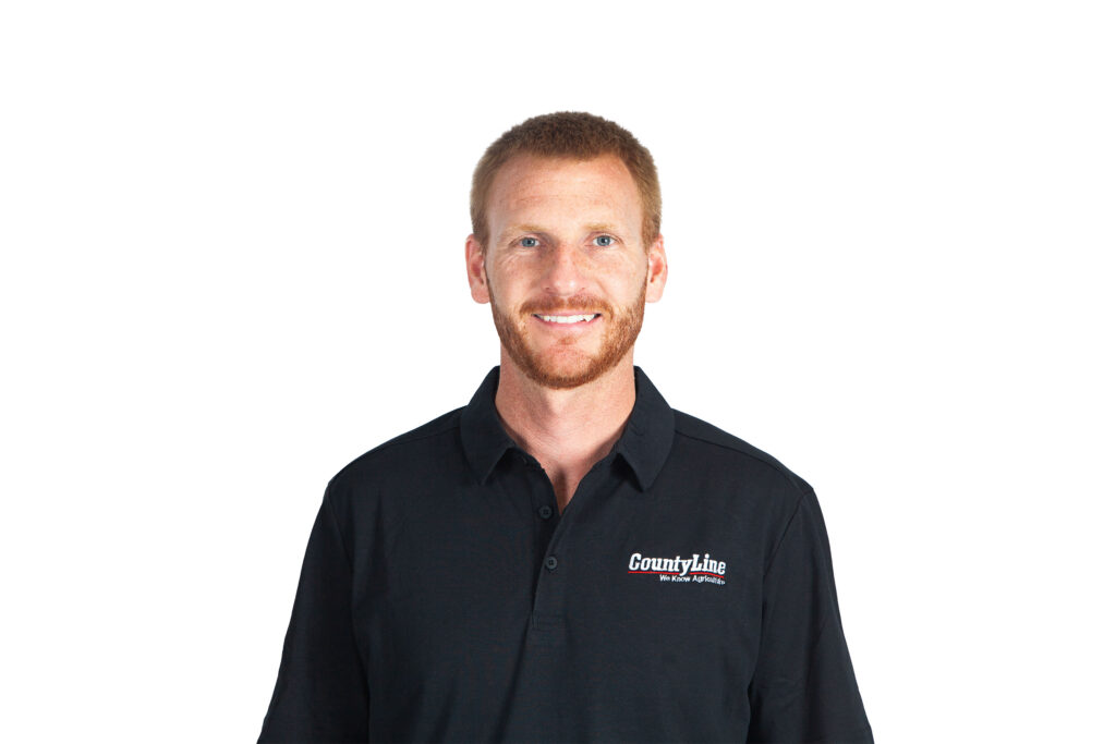 Male, Caucasian, Black polo shirt with CLE logo, Red hair, beard and moustache