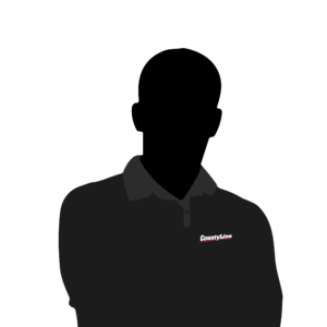 Dark silhouette of of a County Line Equipment staff member