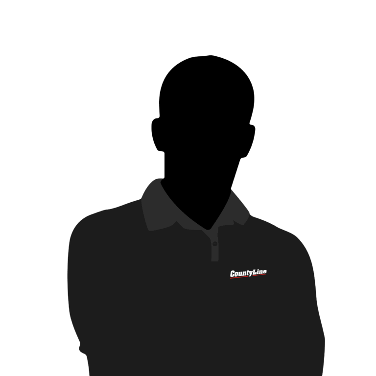 Dark silhouette of of a County Line Equipment staff member