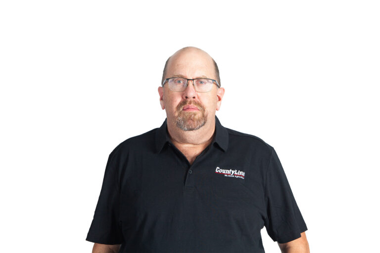 Male, Caucasian, Black polo shirt with CLE logo, Balding with glasses, Beard and moustache