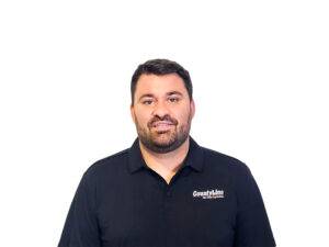 Male, Caucasian, Black polo shirt with CLE logo, Dark brown hair, beard and moustache