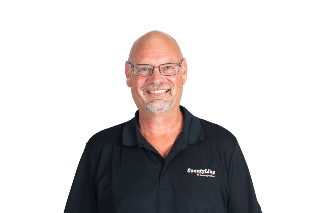 Male, Caucasian; Black polo shirt with CLE logo; Bald with glasses; Beard and moustache