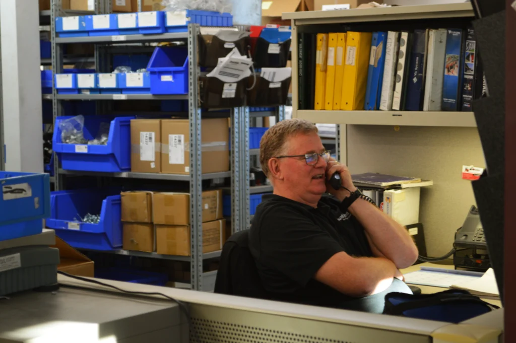 County Line Equipment staff member on the phone