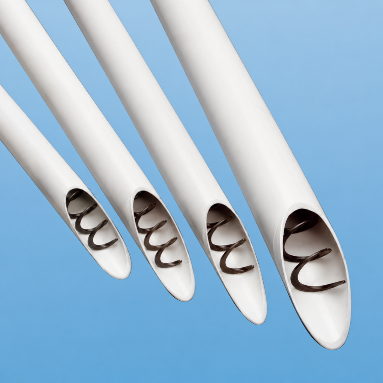 FLEX-AUGER feed delivery tubes with coreless auger for livestock feed conveying