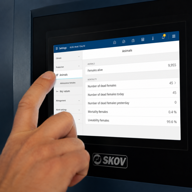 SKOV BlueControl Production Controller touchscreen displaying poultry production data