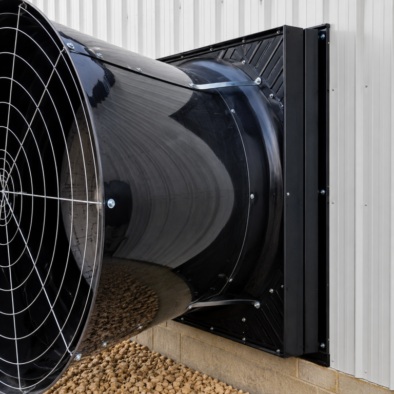 Cumberland Mega Flow 58C 58 inch fiberglass poultry exhaust fan housing mounted on a poultry barn