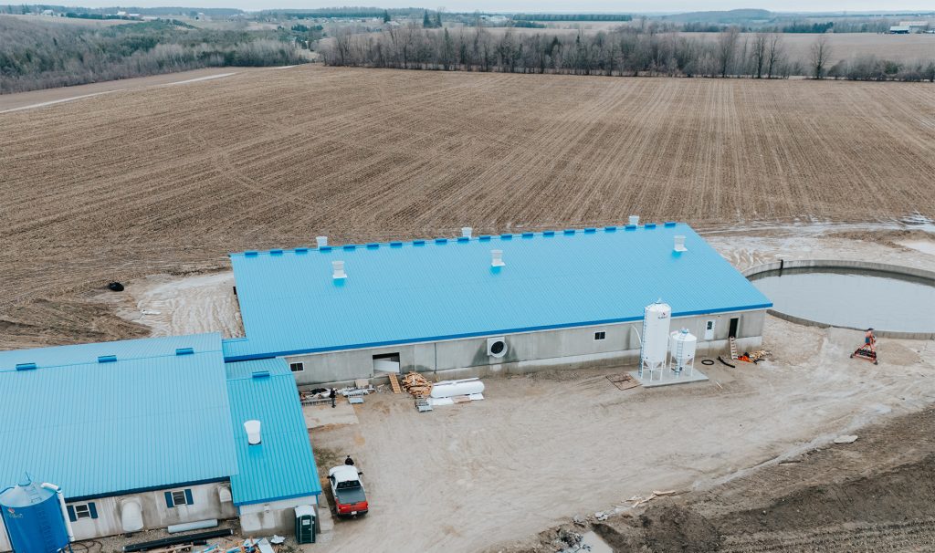 Aerial view of the New Venture Farms gestation hog barn featuring a modern swine facility designed for efficient livestock production.