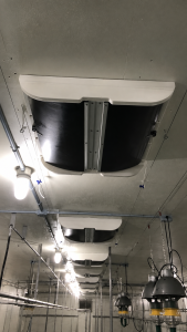 Flow-Right ceiling air inlet installed in a barn ventilation system
